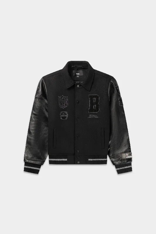 Hooded men jackets with a detachable faux - fur trim for added warmthNFL x BALR. Varsity Jacket Jet Black